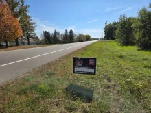 Sign asking people to vote for Royalton